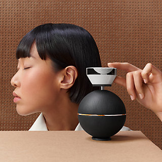 Spherical music box with a porcelain key | Hermès USA